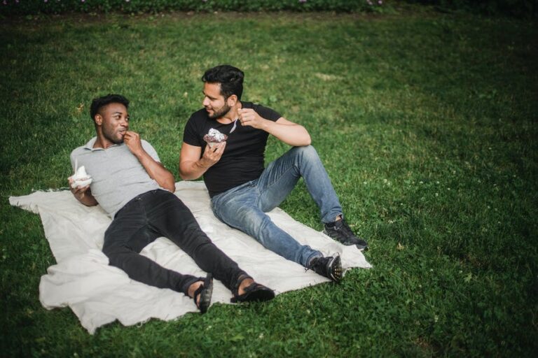 Photo of a Couple Looking at Each Other while Eating Ice Cream