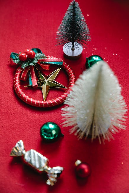 From above of assorted New Year decor with small baubles and candy in wrapper