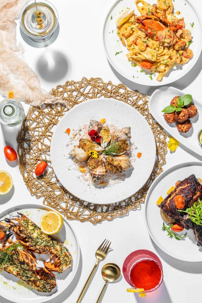 flatlay of varied plated food on white plates