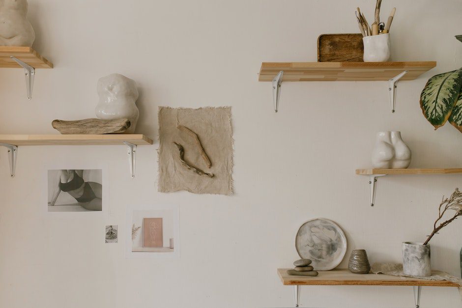 Wooden Shelves with Assorted Pots on a White Wall with Wall Decors