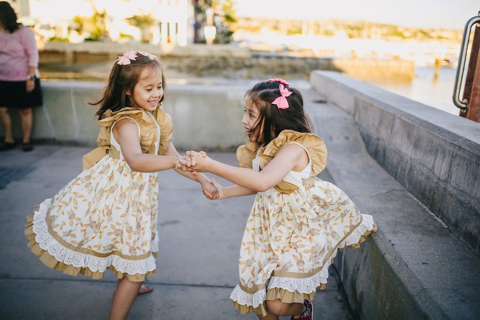 2 Girls in White Floral Dress Dancing on the Street