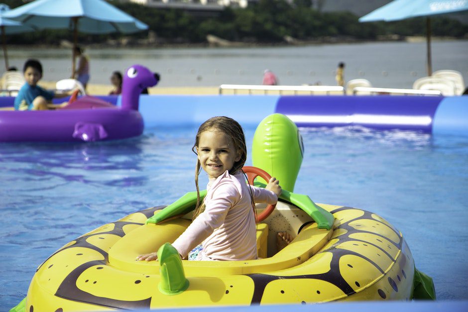 Girl Sitting on a Floater Floating on a Swimming Pool