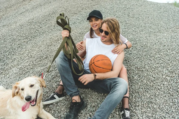 Young couple with dog  Stock Photo, Image