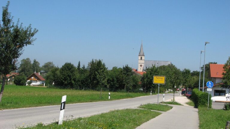 a small town with a church steeps and a church steeps - Petting